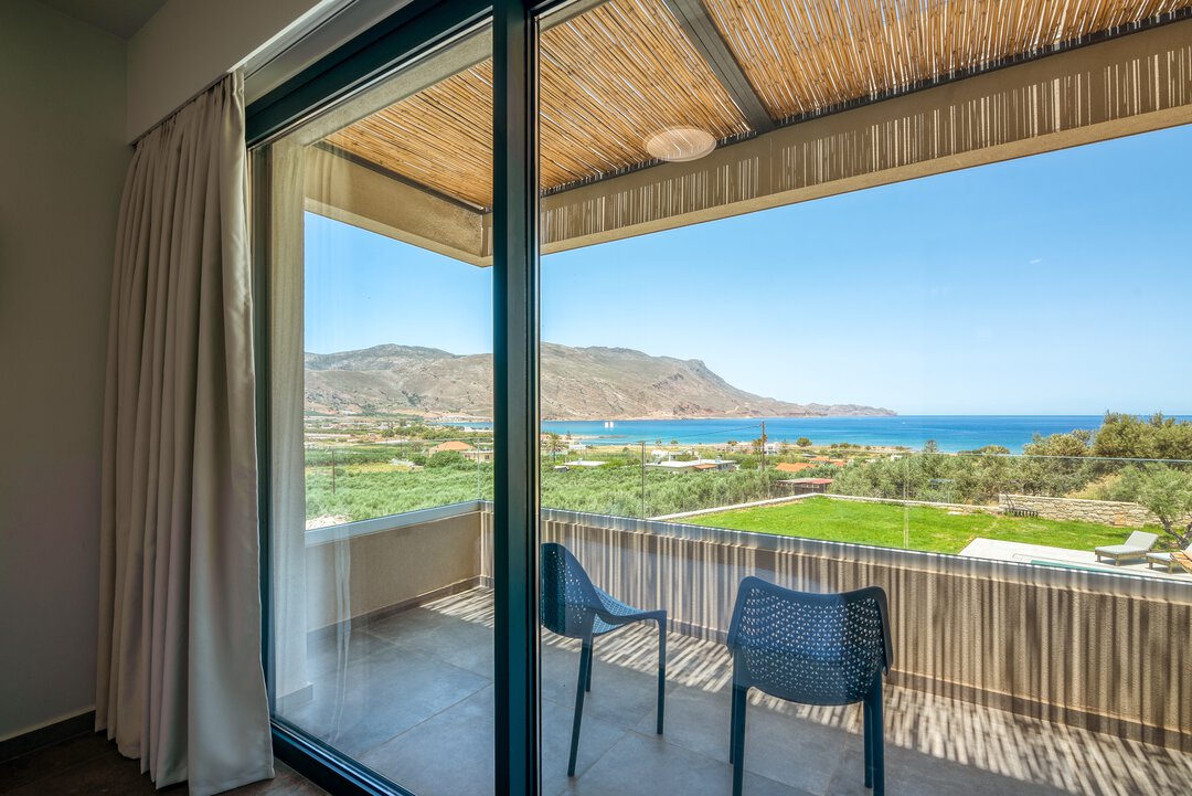 Rainfall shower with matte black fixtures, warm tiles, and spa atmosphere at Nusa Gramvousa, Crete
