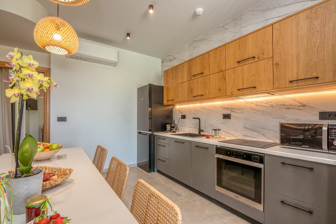 Cozy dining nook with built-in seating and garden outlook at Nusa Gramvousa villa, Kissamos, Crete