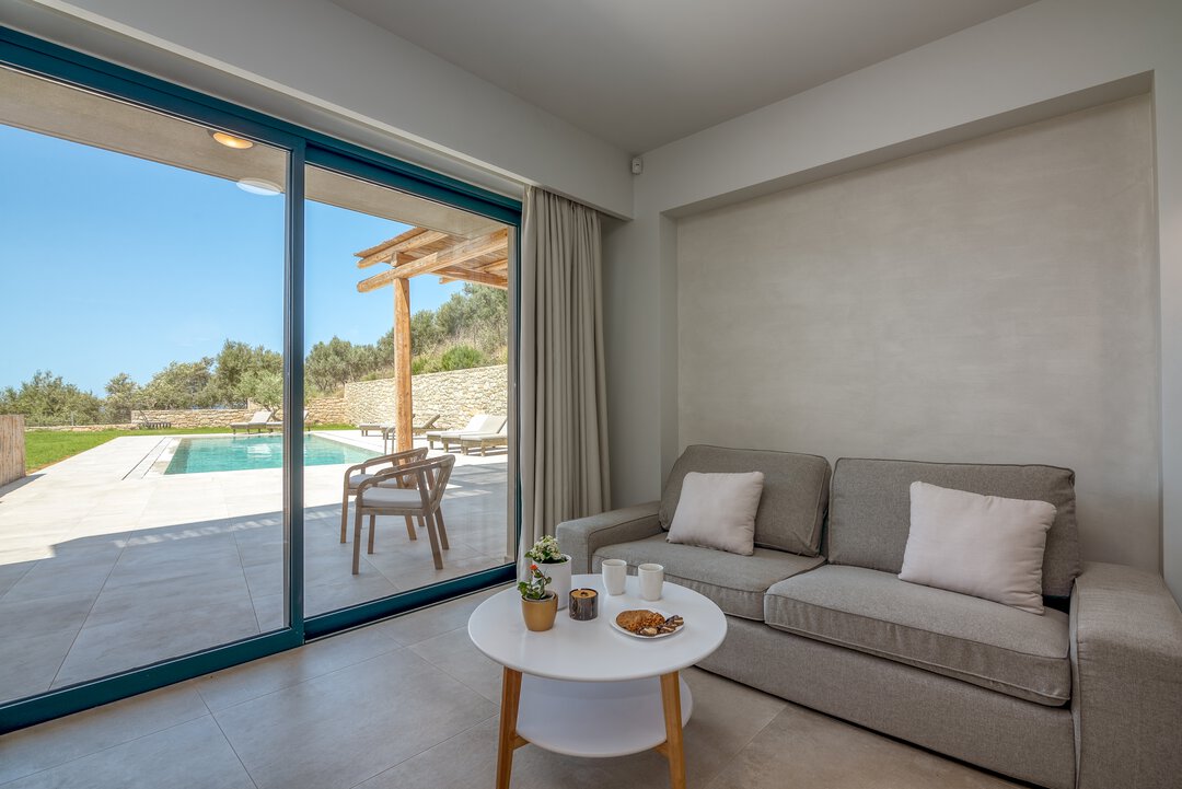 Contemporary kitchen with handleless cabinets, integrated appliances, and clean lines at Nusa Gramvousa, Crete