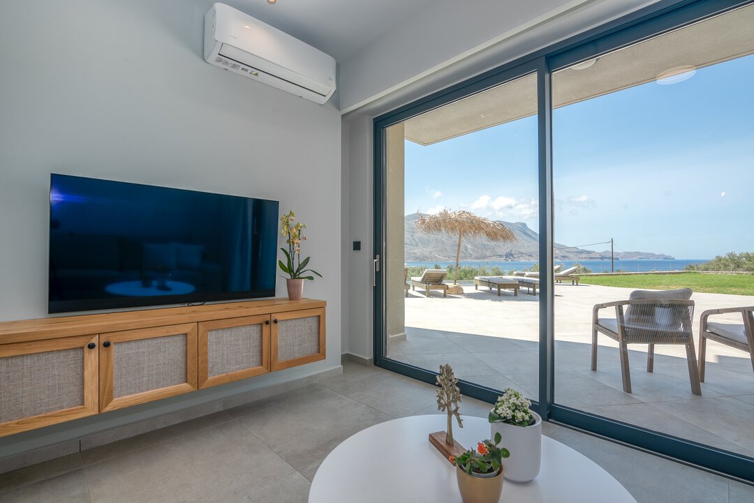 Luxury shower with rainfall head, matte black fixtures, and designer tiles at Nusa Falassarna villa, Crete