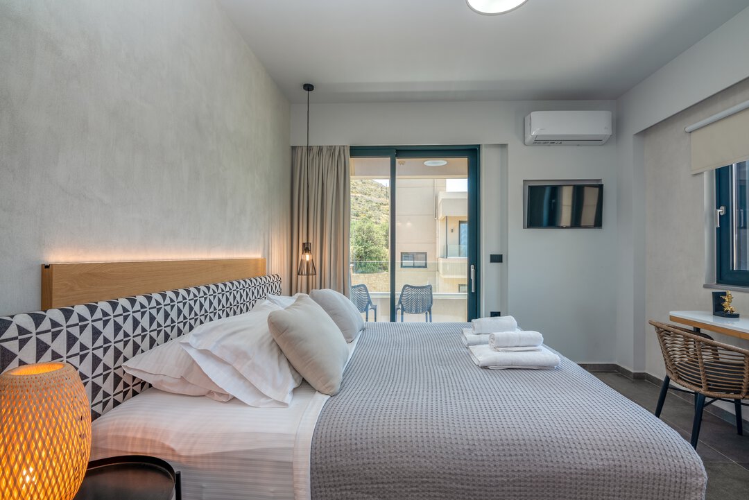 Kitchen workspace with built-in oven, microwave, and preparation area at Nusa Falassarna, Crete