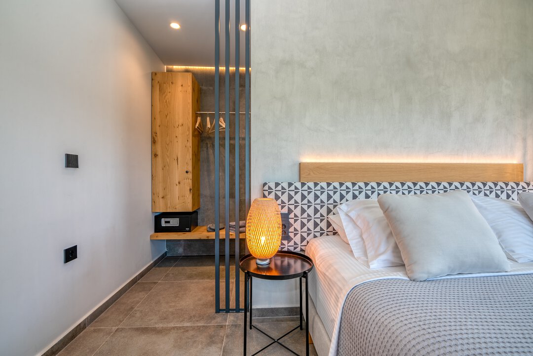 Modern kitchen with oak cabinets, integrated appliances, and clean lines at Nusa Falassarna villa, Crete
