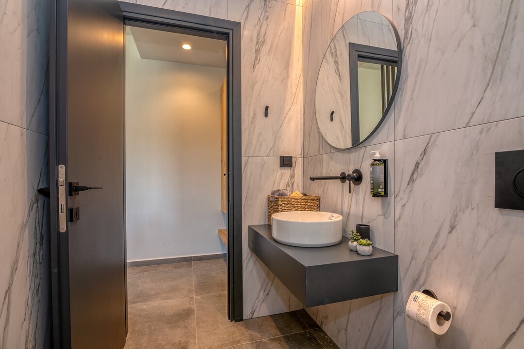 Comfortable living area with modern furniture and natural light at Nusa Falassarna, Crete