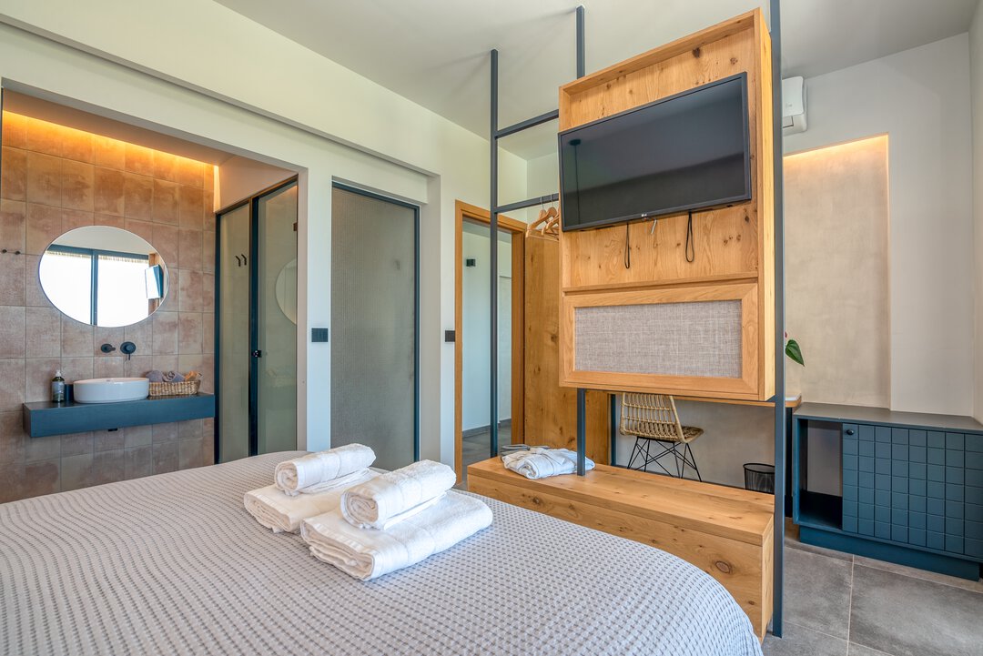 Comfortable bedroom with thoughtful design and peaceful atmosphere at Nusa Falassarna villa, Crete