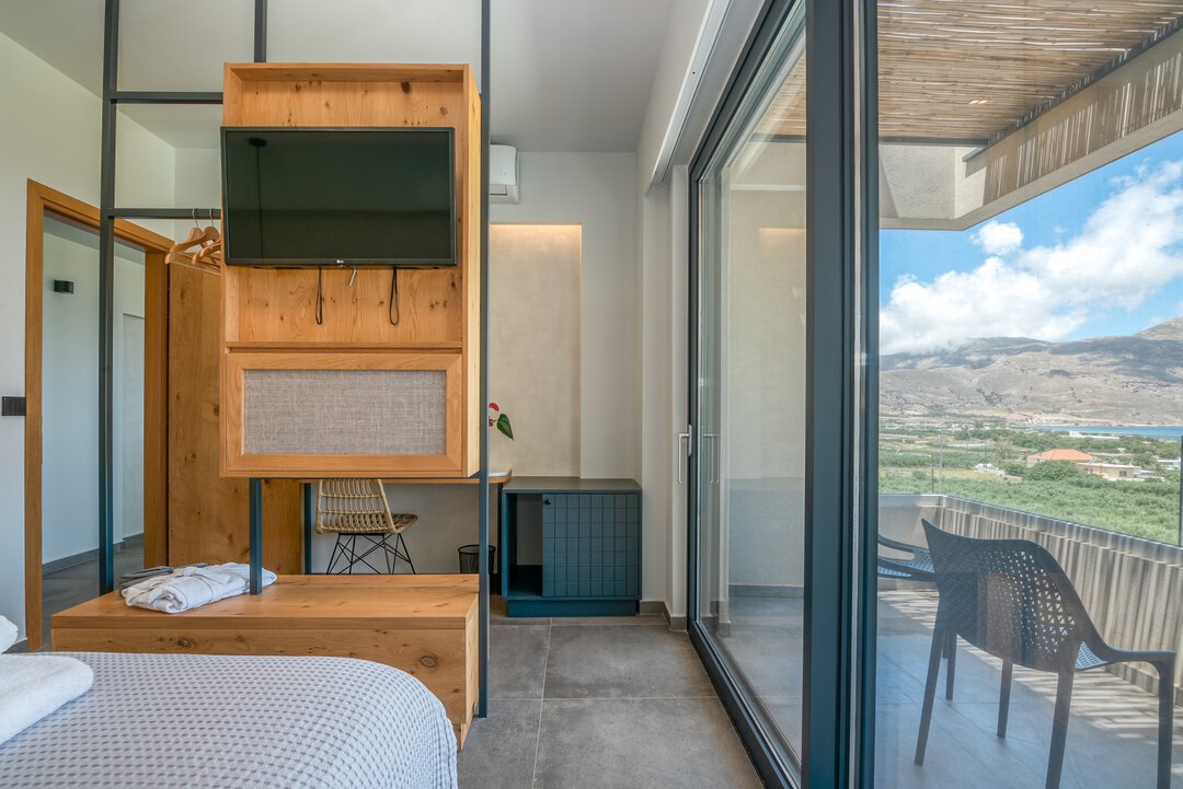 Boutique-style bedroom with designer touches at Nusa Falassarna, Crete