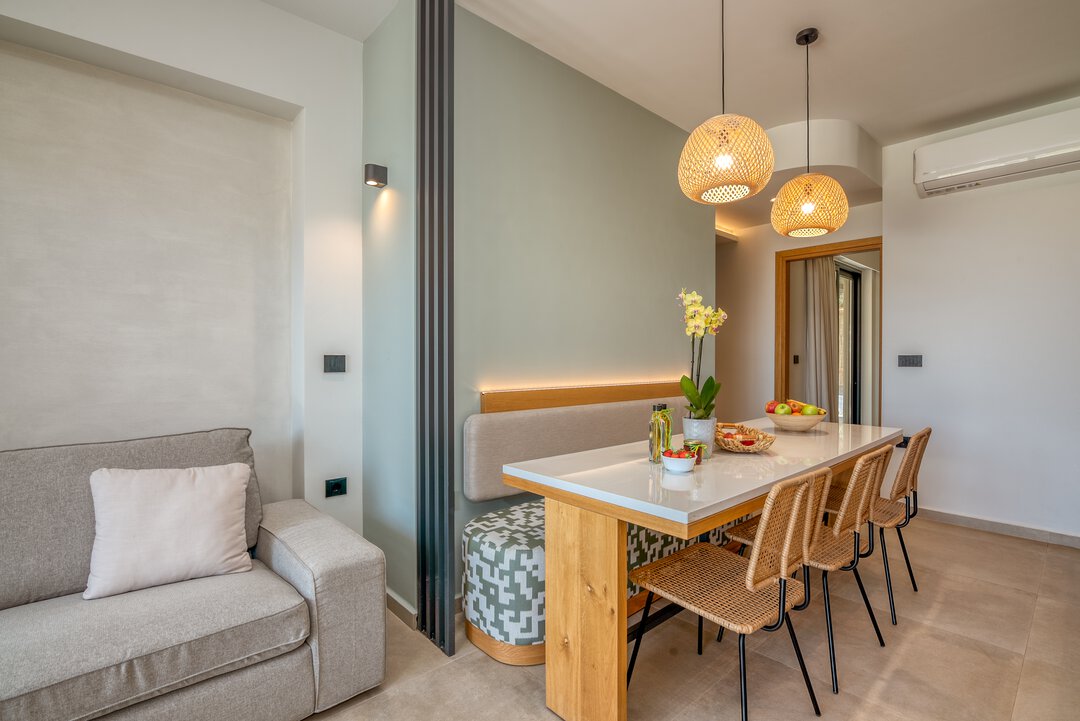 Stylish dining area with wicker chairs at Nusa Balos near Balos Lagoon, Crete